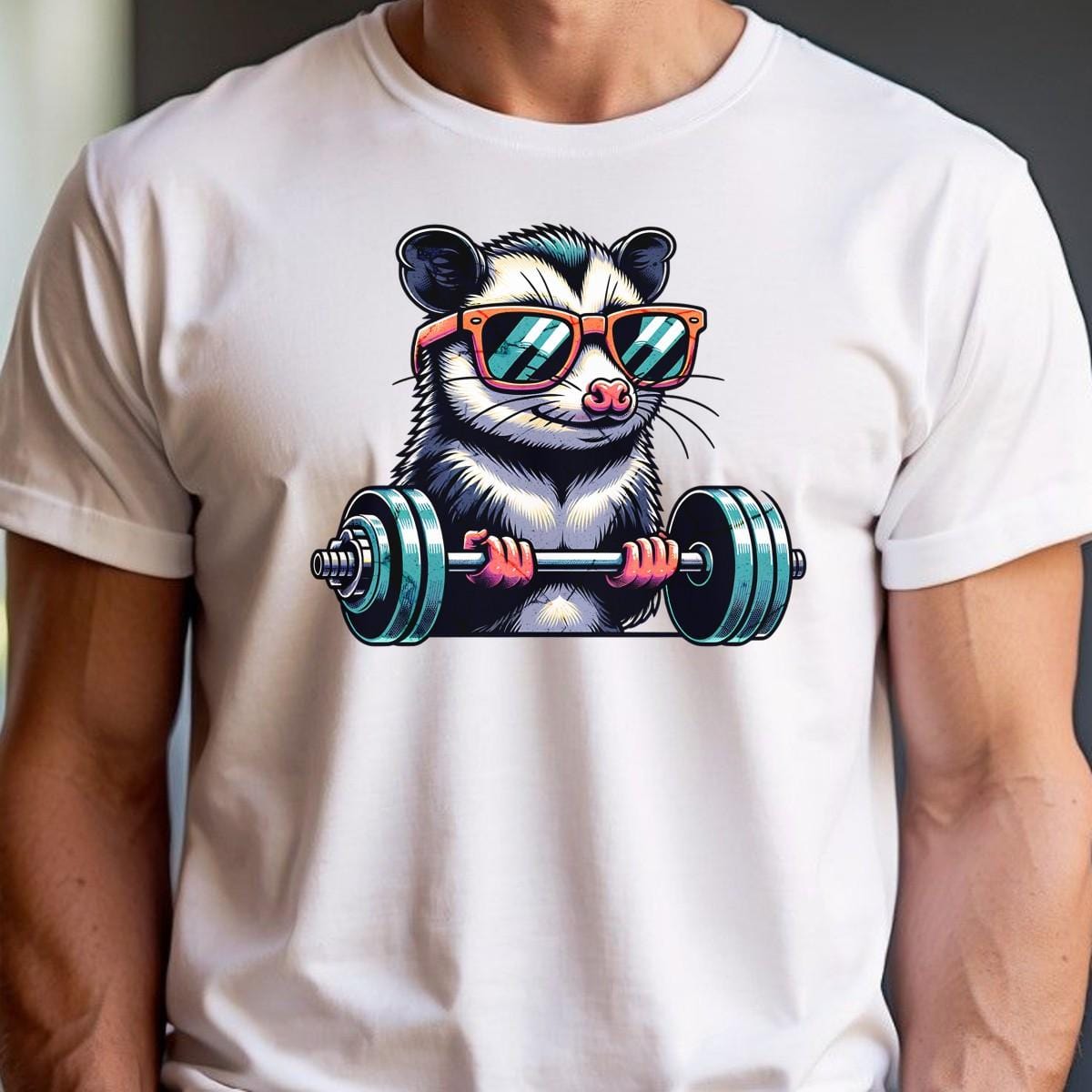 "Playful gym T-shirt featuring a cool possum lifting weights in stylish sunglasses, perfect for fitness enthusiasts and workout motivation."