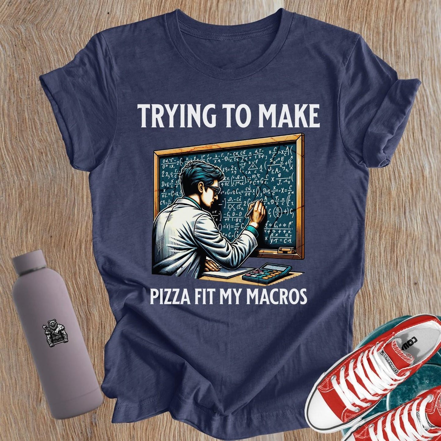 "Graphic T-shirt featuring 'Trying to Make Pizza Fit My Macros' slogan for women who embrace fitness and indulge in pizza."