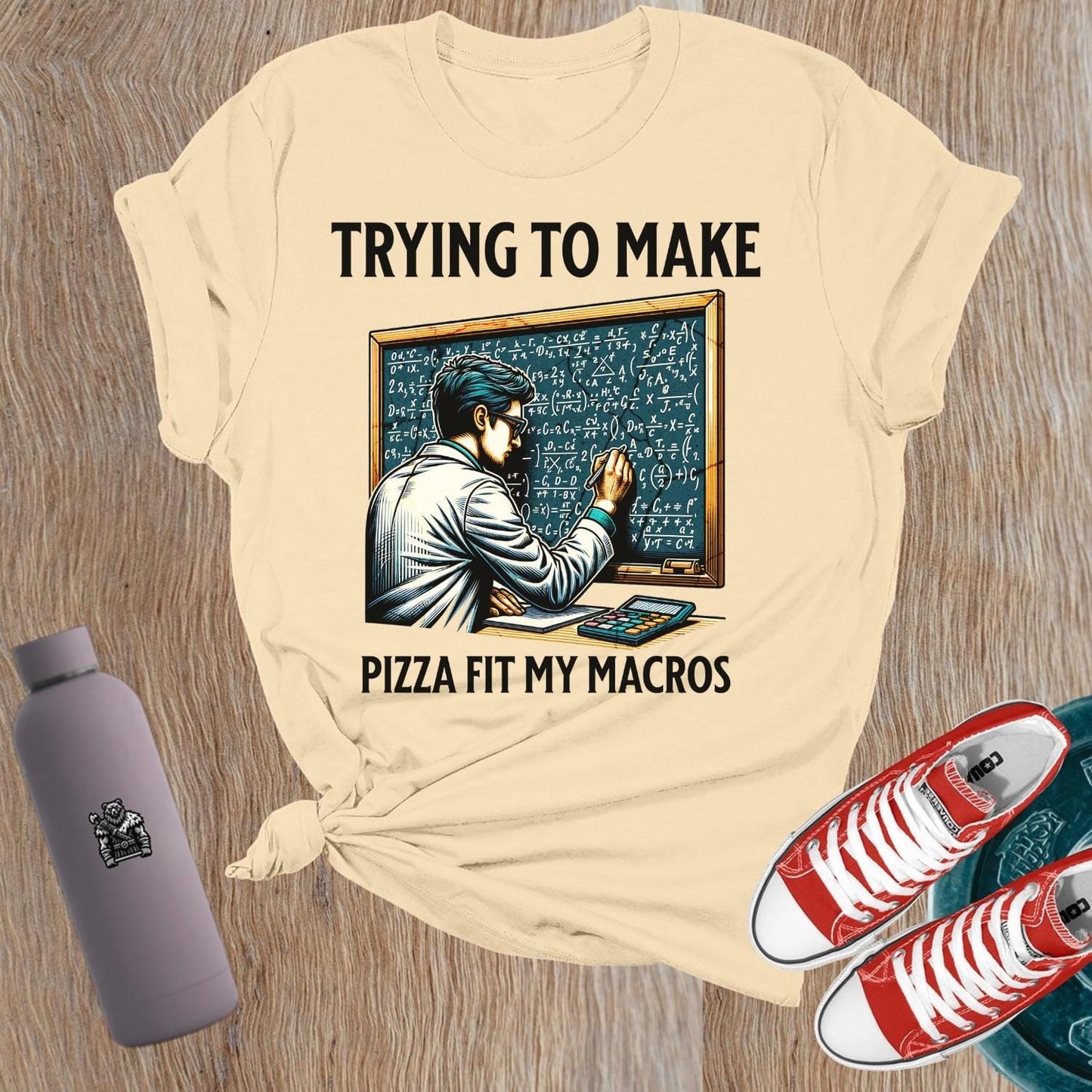 Alt text: "A humorous women’s fitness T-shirt featuring the phrase 'Trying to Make Pizza Fit My Macros'. Ideal for gym lovers, this playful design combines strength and balance, perfect for those who lift. Showcases a vibrant graphic, inspiring fitness journeys and conversations at the gym."