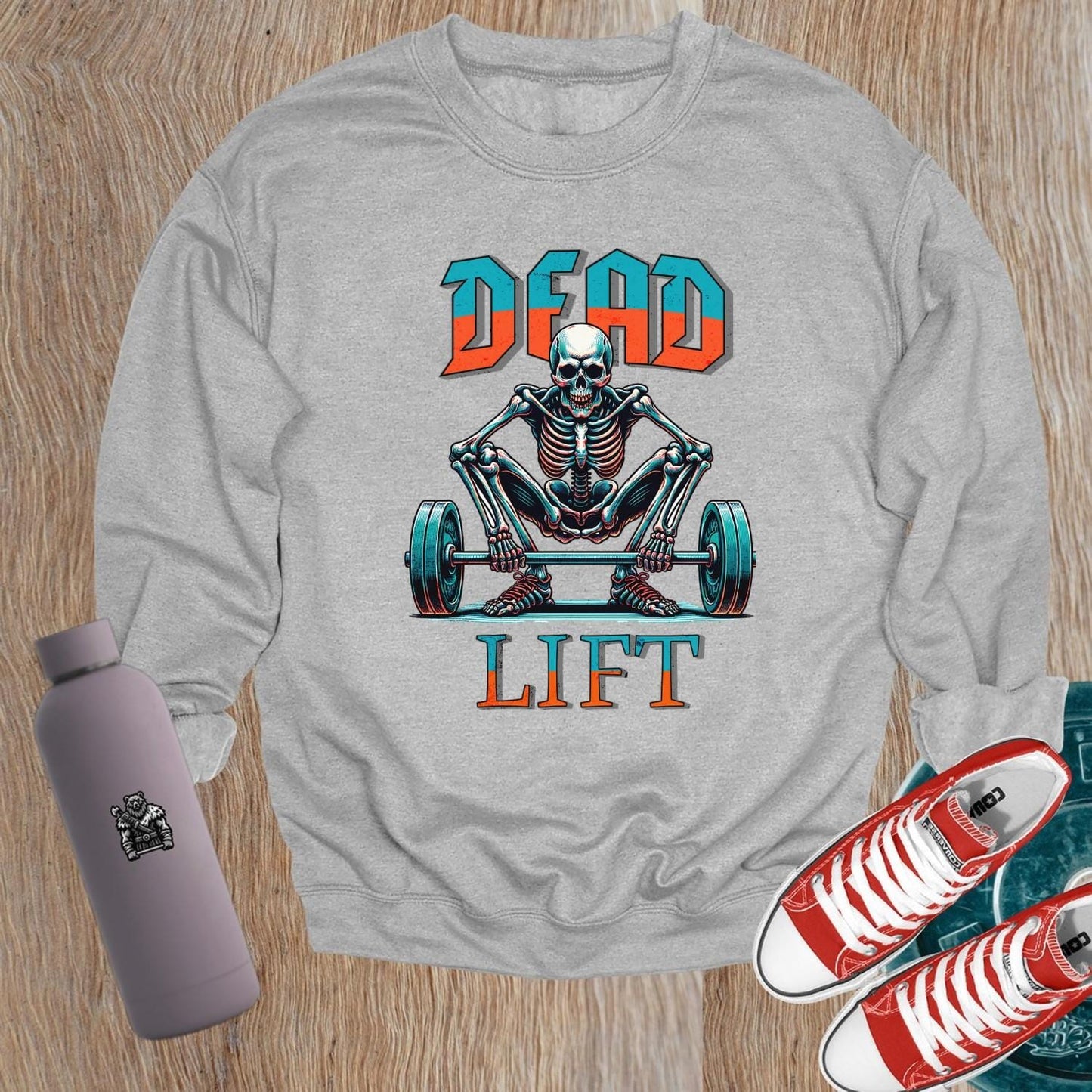 "Edgy 'Dead Lift' sweatshirt featuring a bold skeleton graphic, perfect for gym workouts and casual wear, showcasing strength and style."