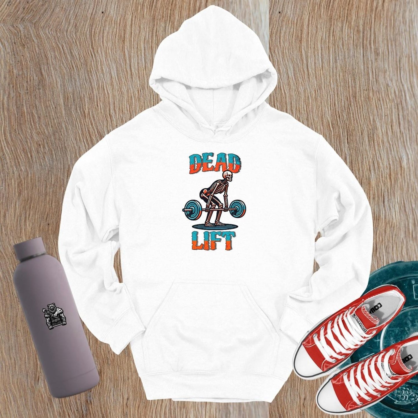 "Black gym hoodie featuring a striking skeleton graphic symbolizing strength and determination, perfect for fitness enthusiasts and workouts."