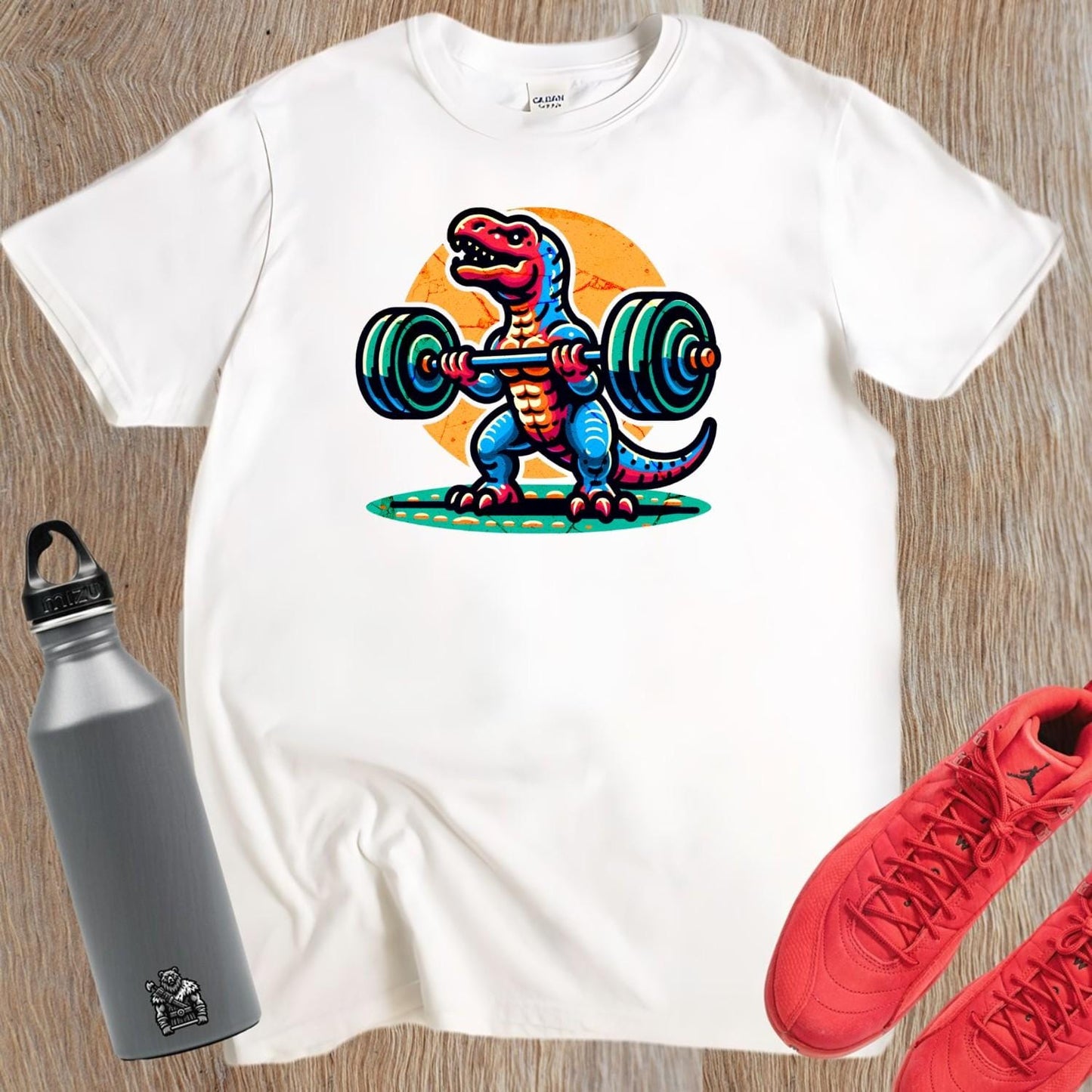 "Fierce dinosaur gym T-shirt featuring a vibrant dinosaur lifting weights, perfect for fitness enthusiasts who want to stand out."