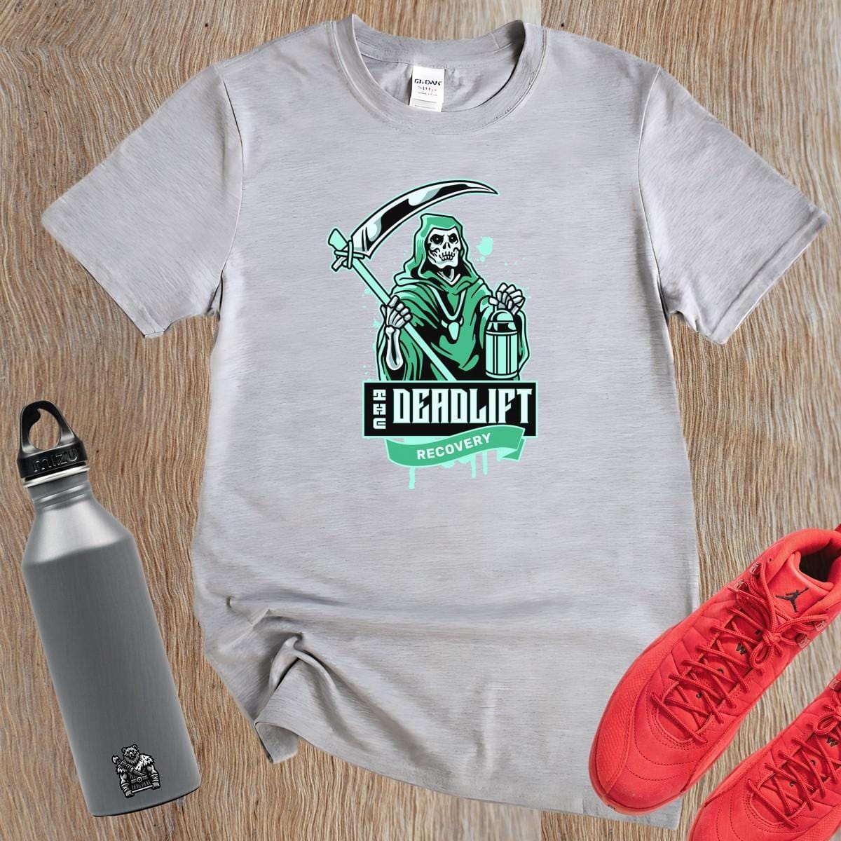 "Graphic gym t-shirt featuring a powerful Grim Reaper design, symbolizing strength and resilience in deadlift recovery for fitness enthusiasts."
