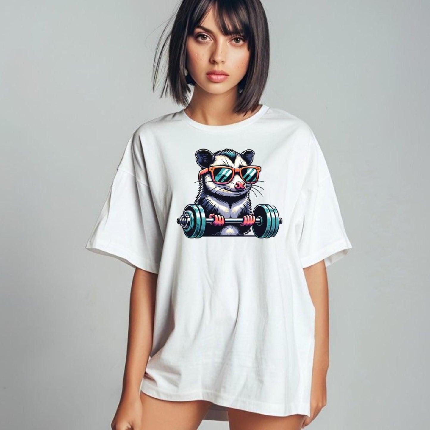 "Playful gym T-shirt featuring a cool possum lifting weights in stylish sunglasses, perfect for fitness enthusiasts and workout motivation."