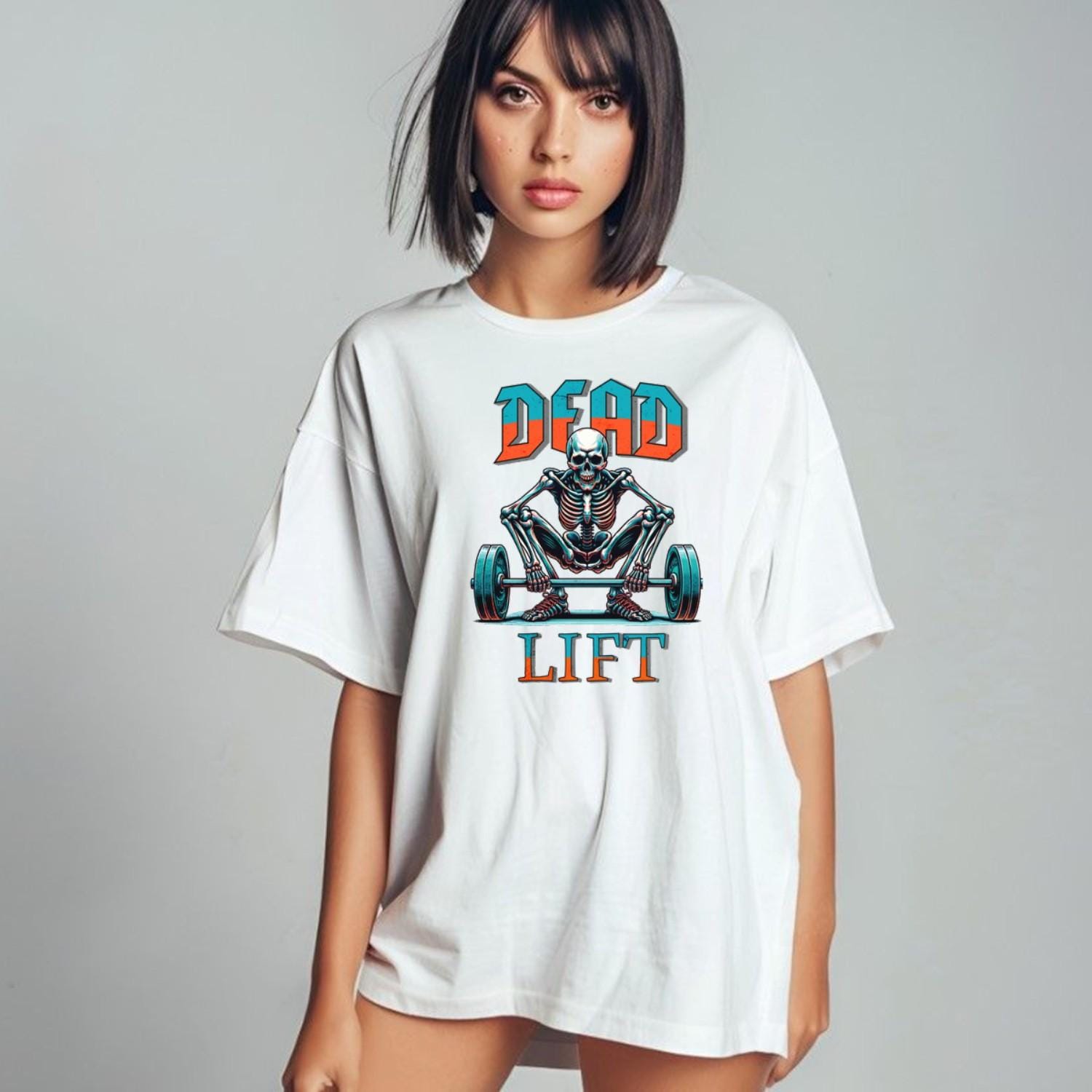 "Graphic T-shirt featuring a skeleton lifting weights, perfect for fitness enthusiasts. Bold design ideal for gym workouts and casual wear."