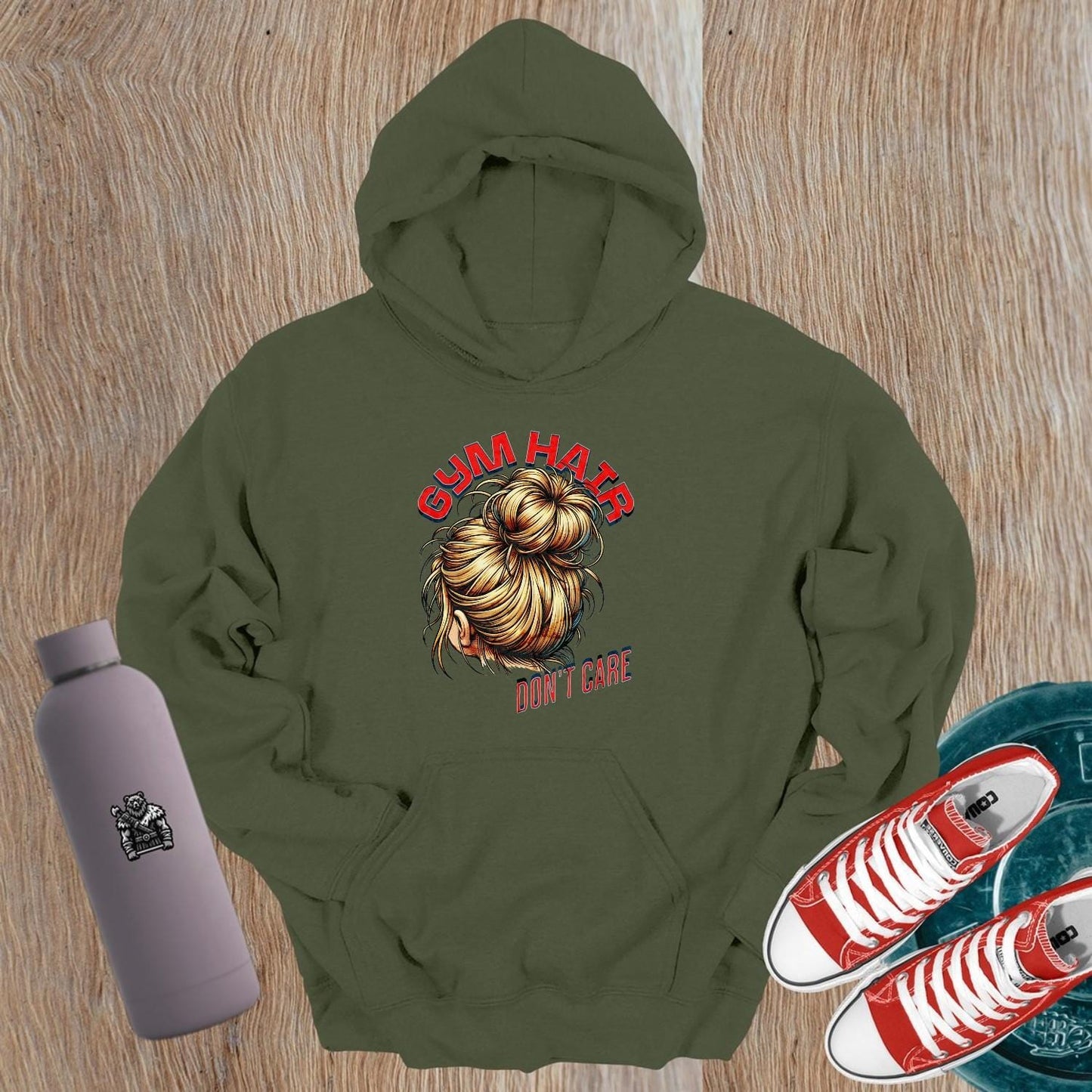Alt text: "Stylish 'Gym Hair, Don't Care' hoodie with bold graphic, perfect for workouts and casual wear. Ideal for fitness enthusiasts."