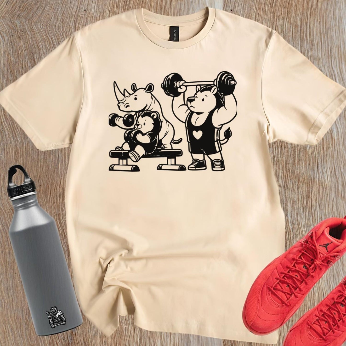 "Playful gym T-shirt featuring a trio of fitness-loving animals, combining fun and comfort for gym enthusiasts and workout motivation."