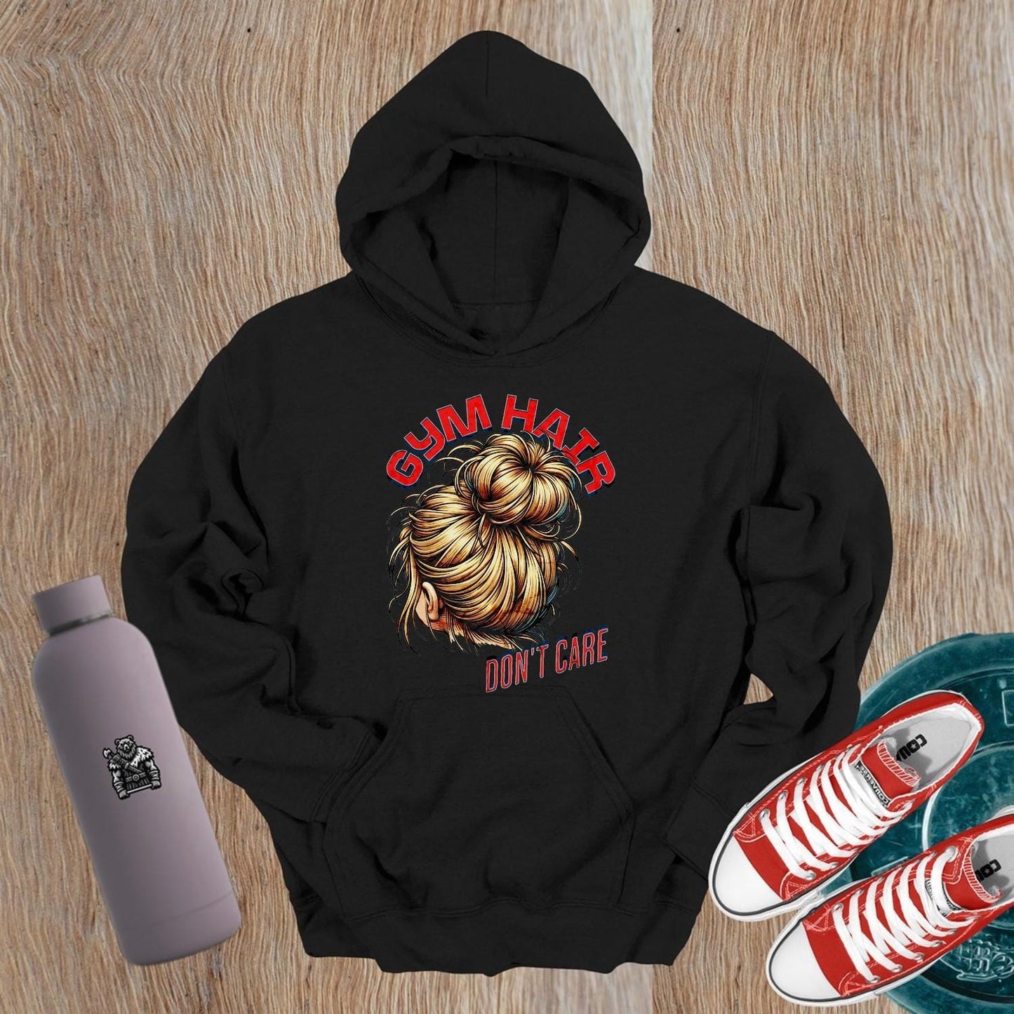 Alt text: "Stylish 'Gym Hair, Don't Care' hoodie with bold graphic, perfect for workouts and casual wear. Ideal for fitness enthusiasts."