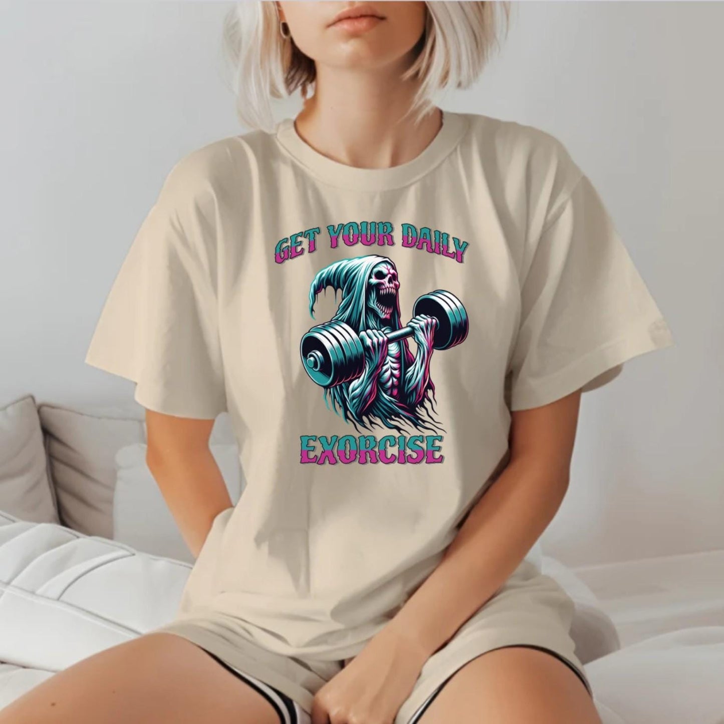"Muted black T-shirt featuring a striking graphic of a skeleton lifting weights, promoting fitness motivation with a quirky style."