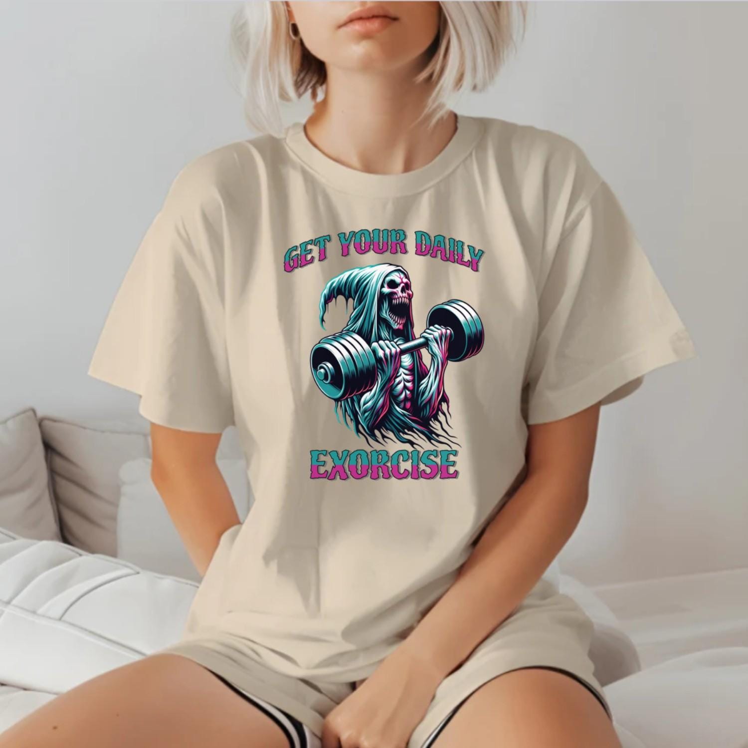 "Muted black T-shirt featuring a striking graphic of a skeleton lifting weights, promoting fitness motivation with a quirky style."