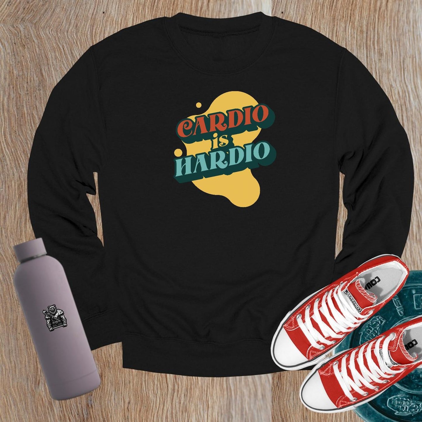 Alt text: "Crewneck sweatshirt with bold 'CARDIO is HARDIO' print, perfect for gym workouts or casual wear, inspiring fitness motivation."