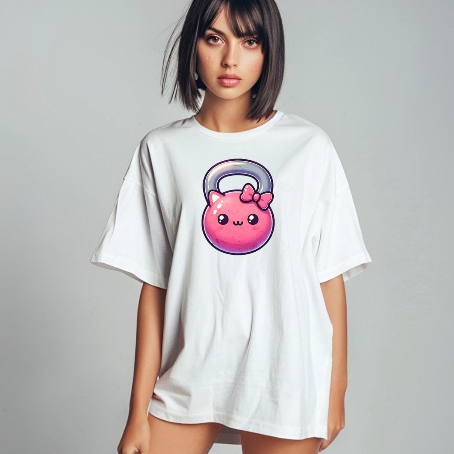 Alt text: "Kawaii Kettlebell T-shirt featuring a cute pink kettlebell with a bow, perfect for gym workouts and stylish casual wear."