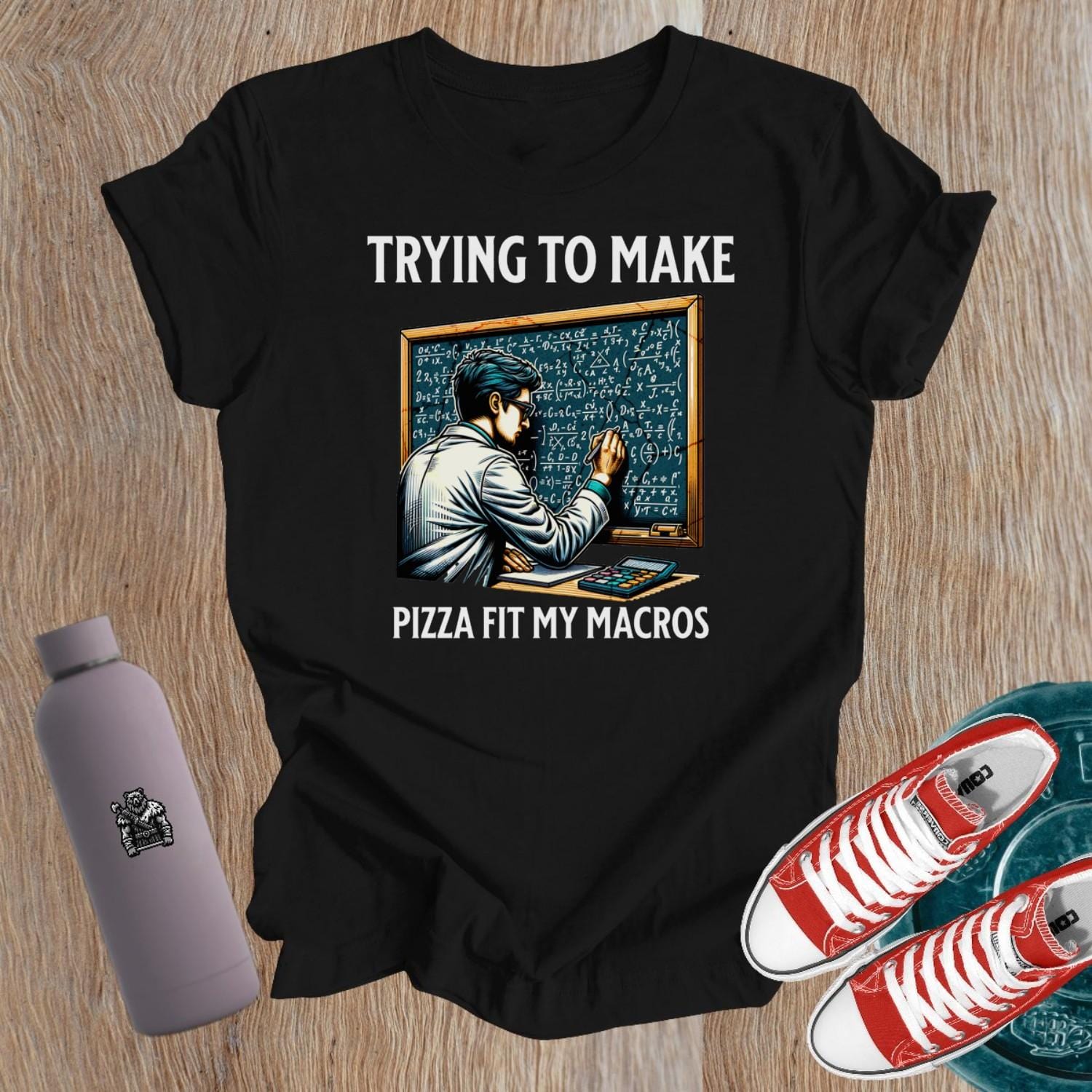 "Graphic T-shirt featuring 'Trying to Make Pizza Fit My Macros' slogan for women who embrace fitness and indulge in pizza."