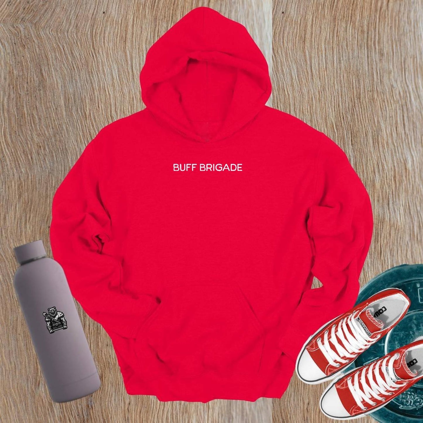 "Graphic gym hoodie featuring bold 'Buff Brigade' design, combining style and comfort for fitness enthusiasts. Ideal for workouts."