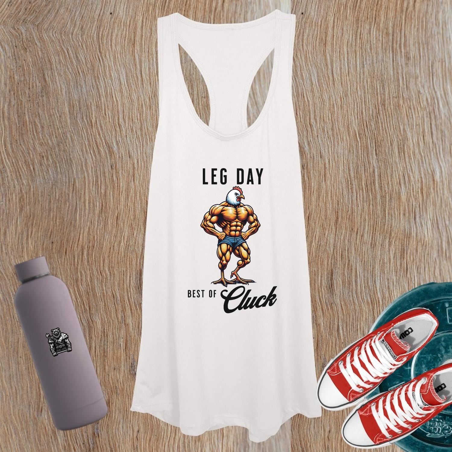 "Bold women’s gym tank top featuring a humorous muscular chicken graphic, designed for comfort and style during workouts or casual outings."