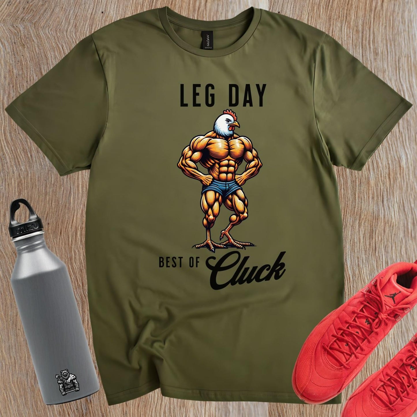 Muscular chicken graphic gym T-shirt, perfect for fitness enthusiasts. Bold design motivates workouts and stands out in the gym.