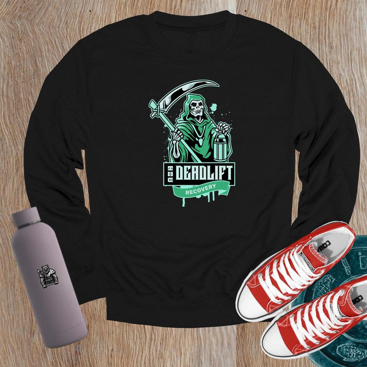 "Edgy black crewneck sweatshirt with 'Deadlift Recovery' graphic, perfect for gym enthusiasts and fitness lovers. Comfortable fit."