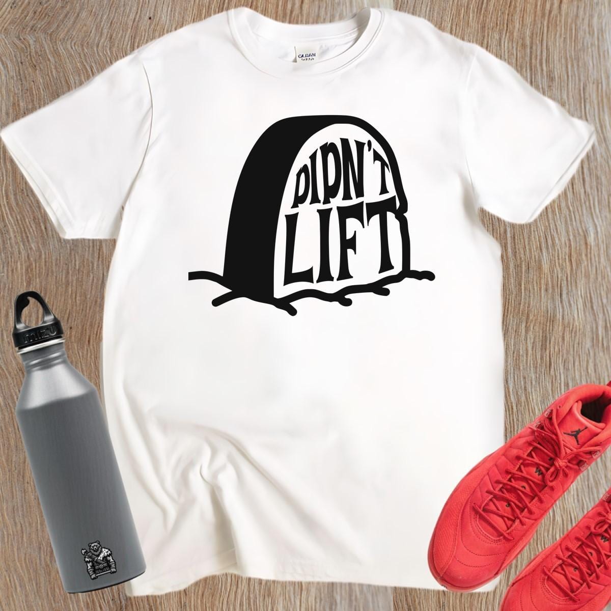 Alt text: "Playful ‘Didn’t Lift’ graphic tee showcasing bold lettering for gym enthusiasts, blending humor and fitness. Perfect for workouts!"