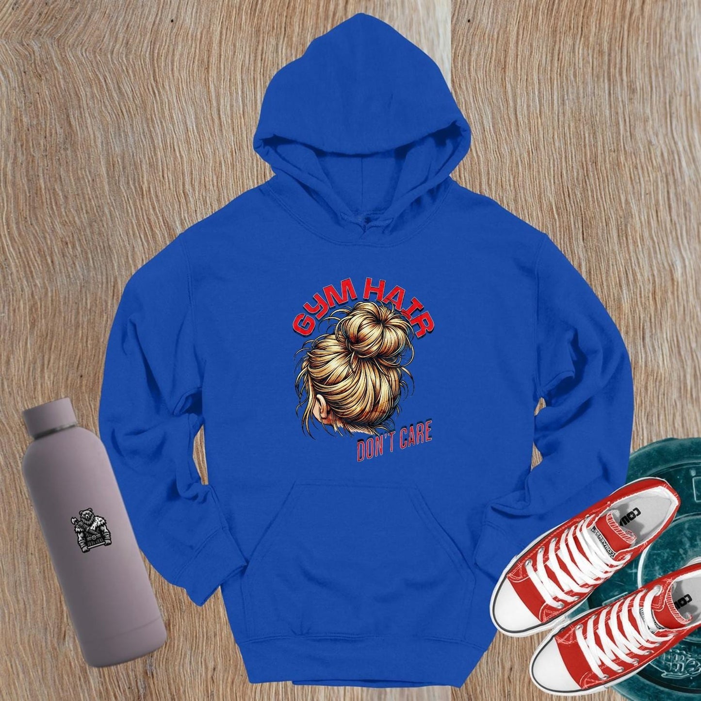 Alt text: "Stylish 'Gym Hair, Don't Care' hoodie with bold graphic, perfect for workouts and casual wear. Ideal for fitness enthusiasts."