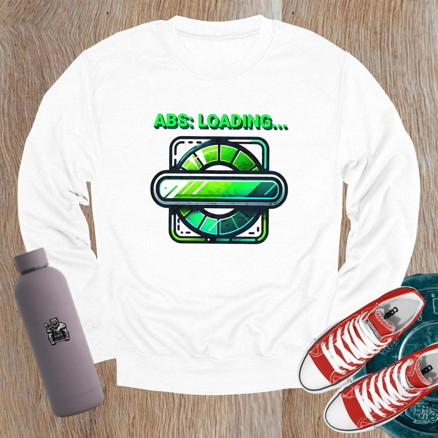 "Lightweight gray crewneck sweatshirt featuring 'ABS: LOADING...' graphic. Perfect for gym workouts and casual wear, showcasing fitness focus."