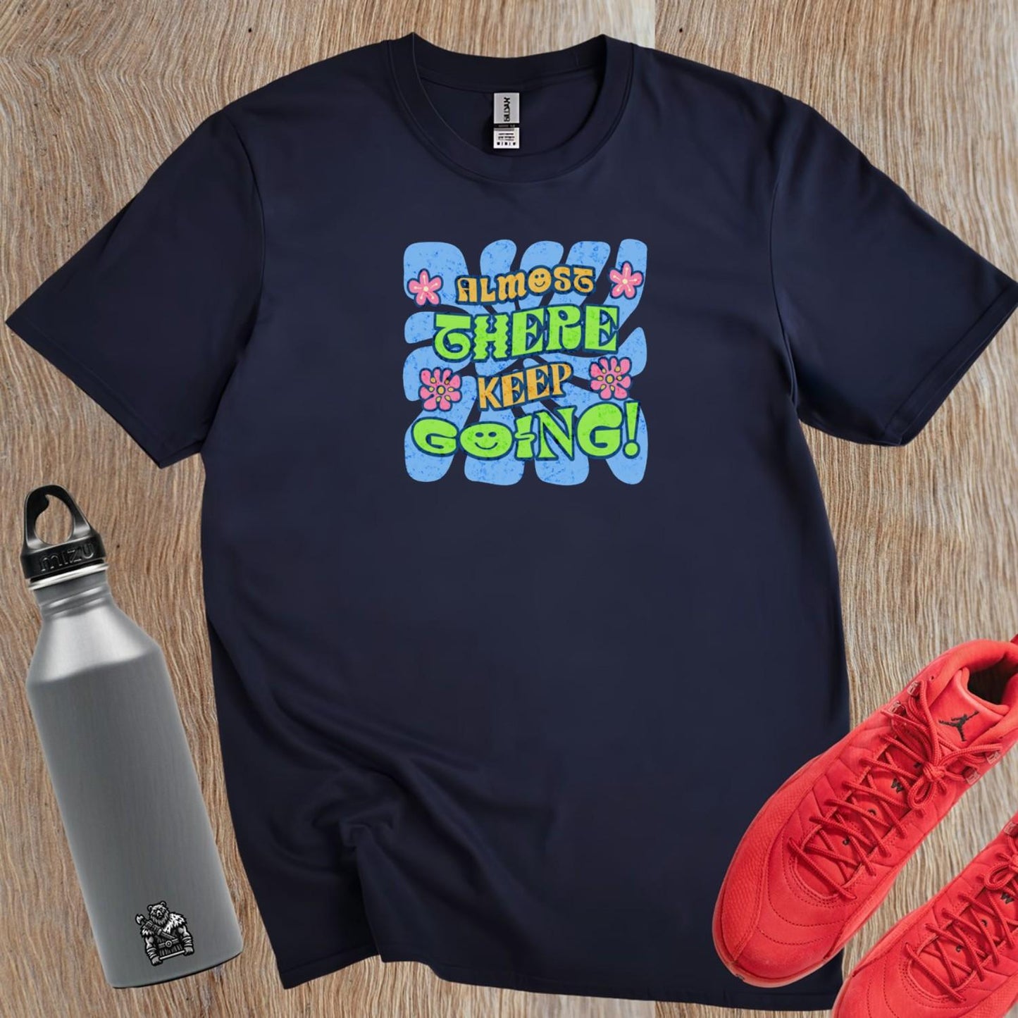 "Vibrant 'Almost There, Keep Going!' graphic gym T-shirt, featuring motivational design for fitness enthusiasts to inspire perseverance."