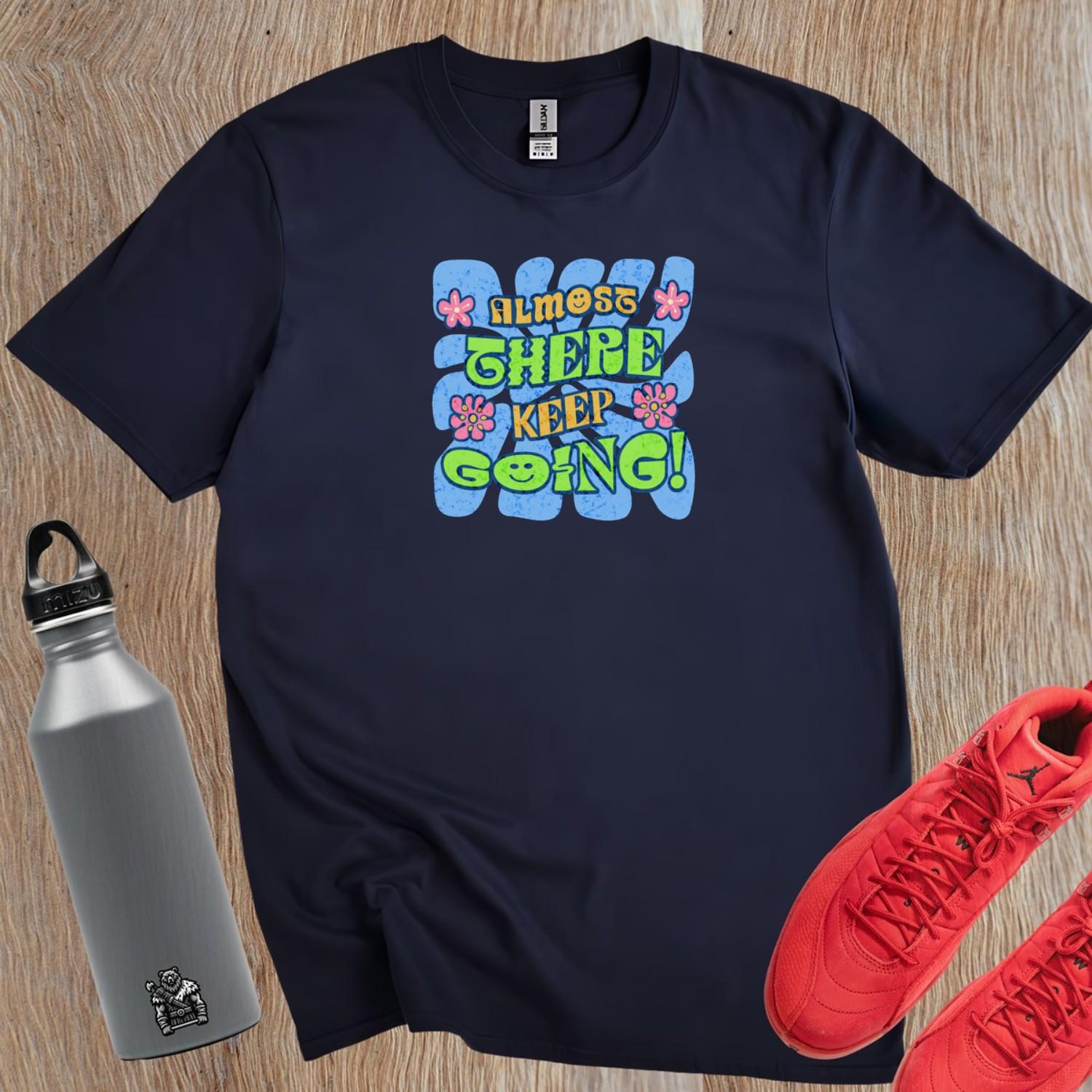 "Vibrant 'Almost There, Keep Going!' graphic gym T-shirt, featuring motivational design for fitness enthusiasts to inspire perseverance."