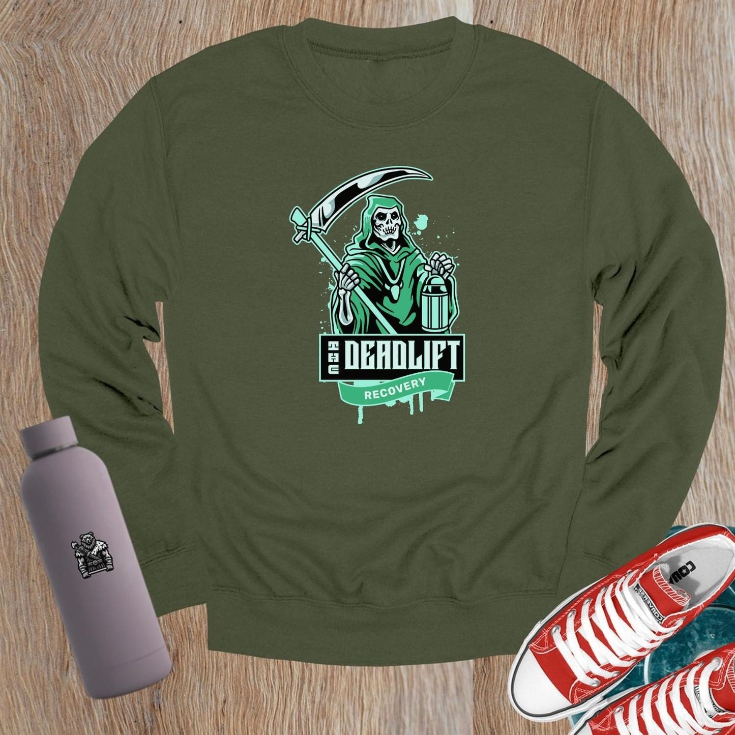 "Edgy black crewneck sweatshirt with 'Deadlift Recovery' graphic, perfect for gym enthusiasts and fitness lovers. Comfortable fit."