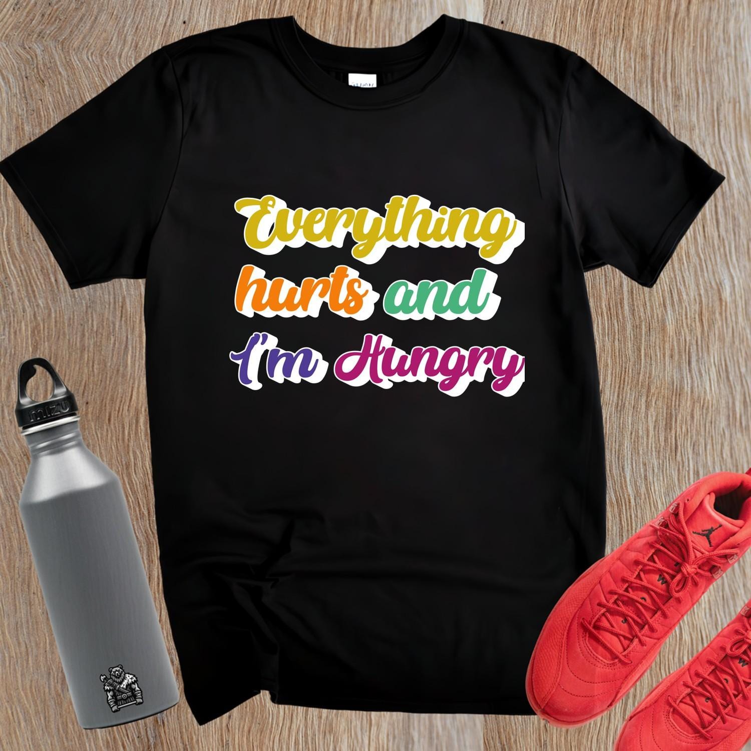 "Vibrant gym T-shirt reading 'Everything Hurts and I'm Hungry,' perfect for fitness enthusiasts who push their limits and crave results."