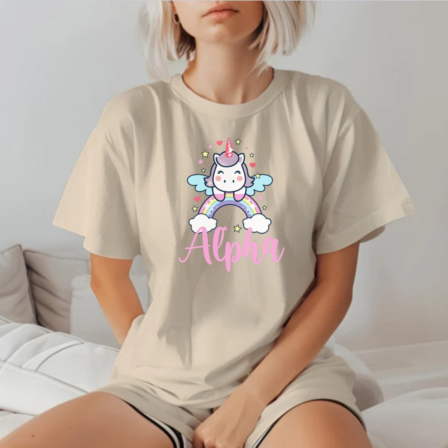 "Colorful Alpha T-shirt featuring a cute unicorn, rainbows, and sparkling stars, perfect for gym workouts and showcasing individuality."