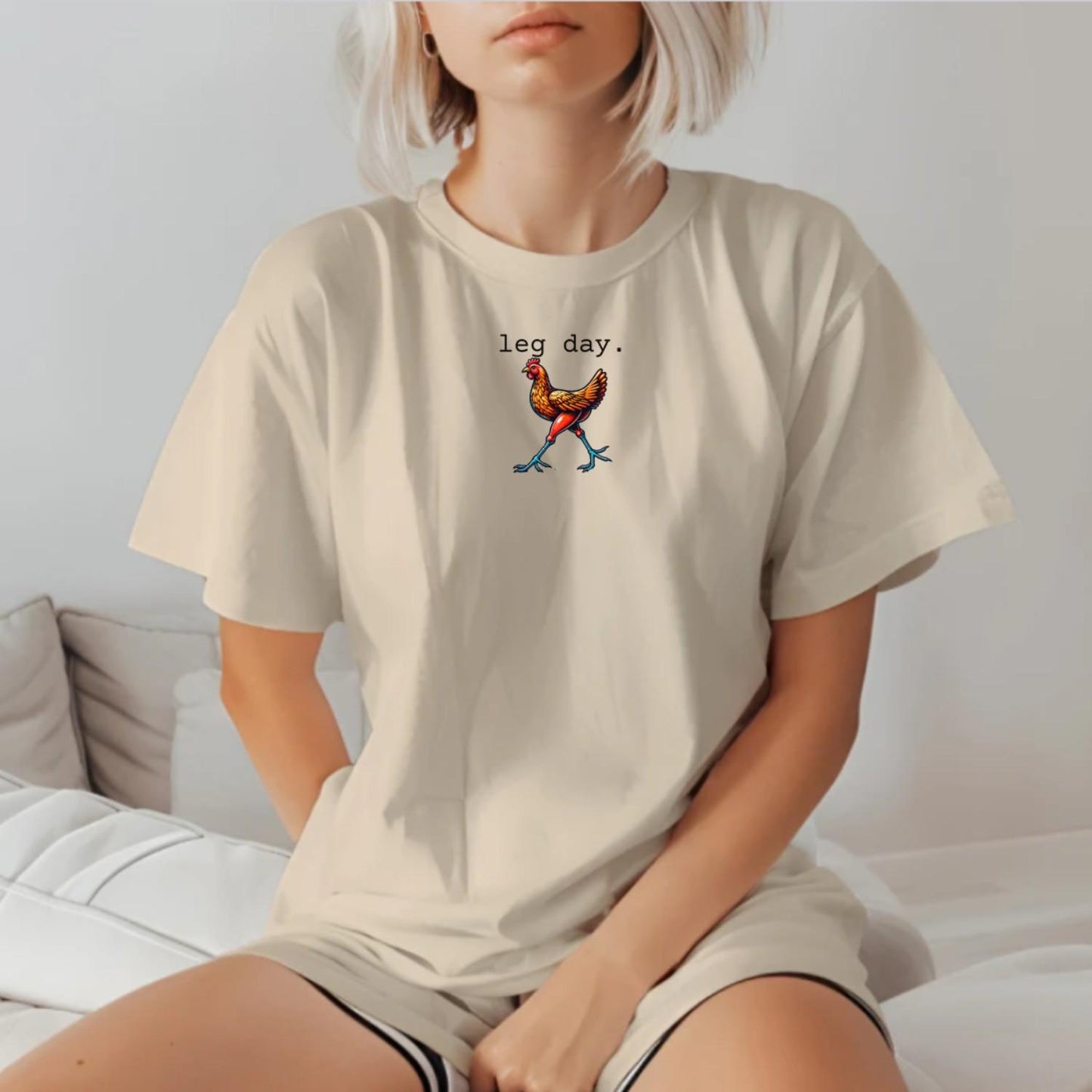 "Vibrant 'Leg Day' gym T-shirt featuring a playful chicken design, perfect for fitness enthusiasts seeking motivation and style."