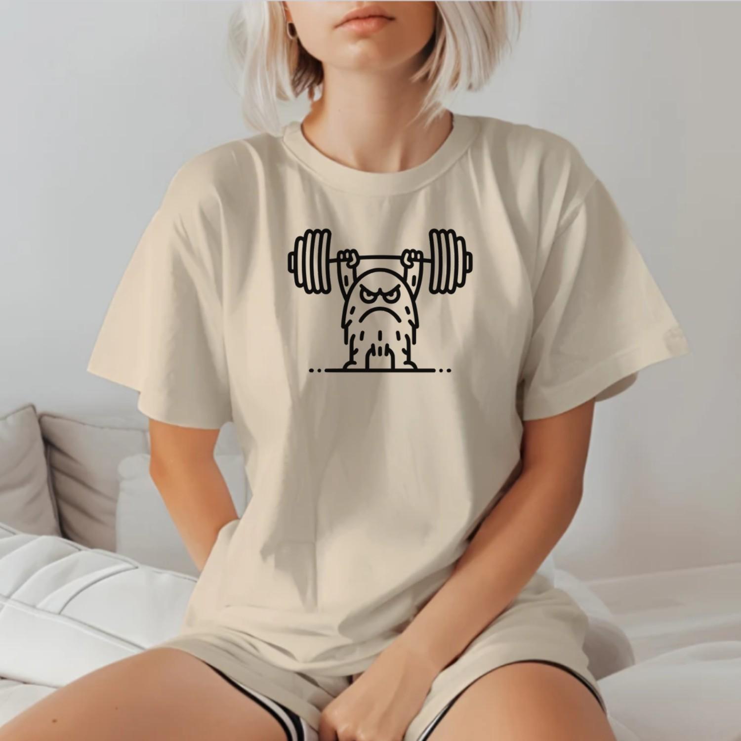 "Graphic T-shirt featuring a fierce creature lifting weights, perfect for gym enthusiasts. Motivational, stylish workout apparel design."
