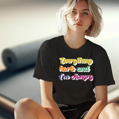 "Vibrant gym T-shirt reading 'Everything Hurts and I'm Hungry,' perfect for fitness enthusiasts who push their limits and crave results."