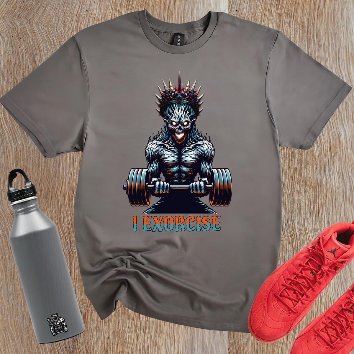 Alt text: "Bold 'I Exorcise' t-shirt featuring a fierce skeletal creature lifting weights, perfect for gym enthusiasts and fitness lovers."