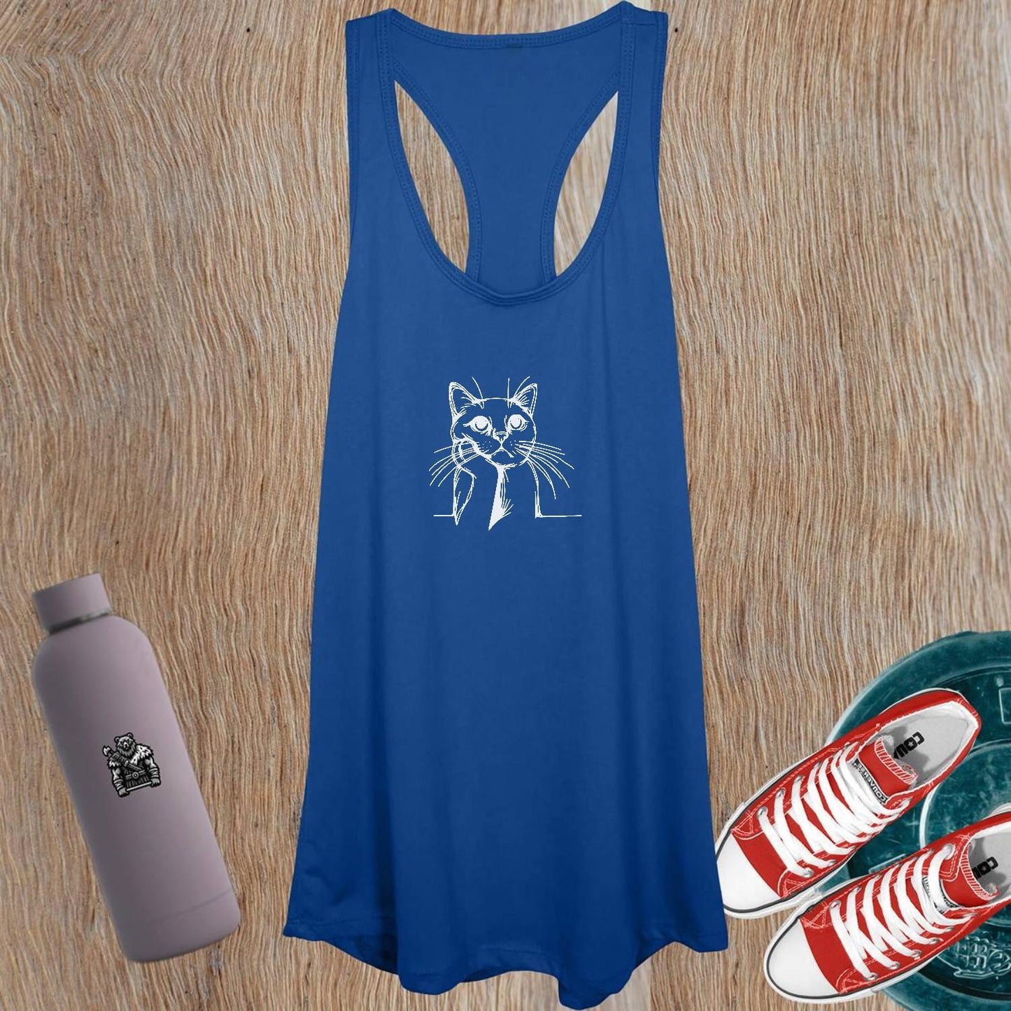 "Women's tank top featuring a playful cat design, perfect for workouts or casual outings; combines comfort, style, and personality."