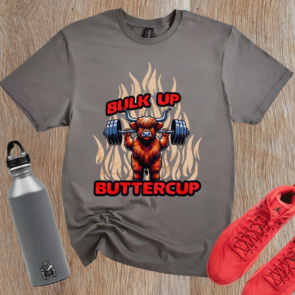 "Bulk Up Buttercup T-shirt featuring a playful lifted Highland cow design, perfect for motivational gym workouts and casual lifting."