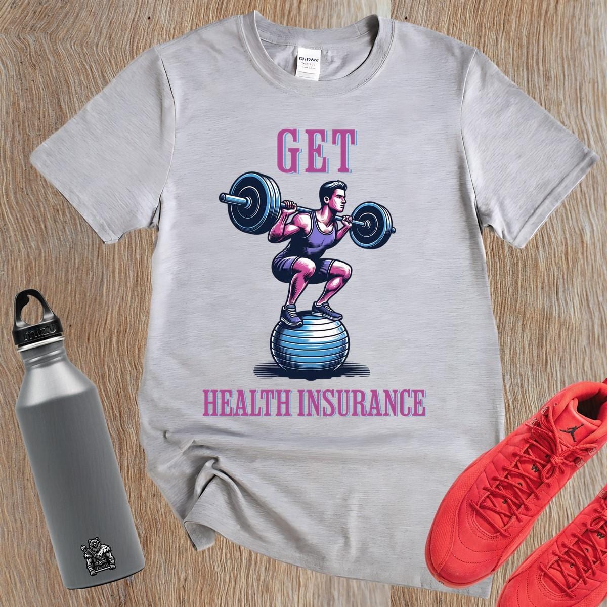 "Bold 'Get Health Insurance' gym tee featuring motivational design, perfect for workouts, lifting, running, or casual fitness wear."