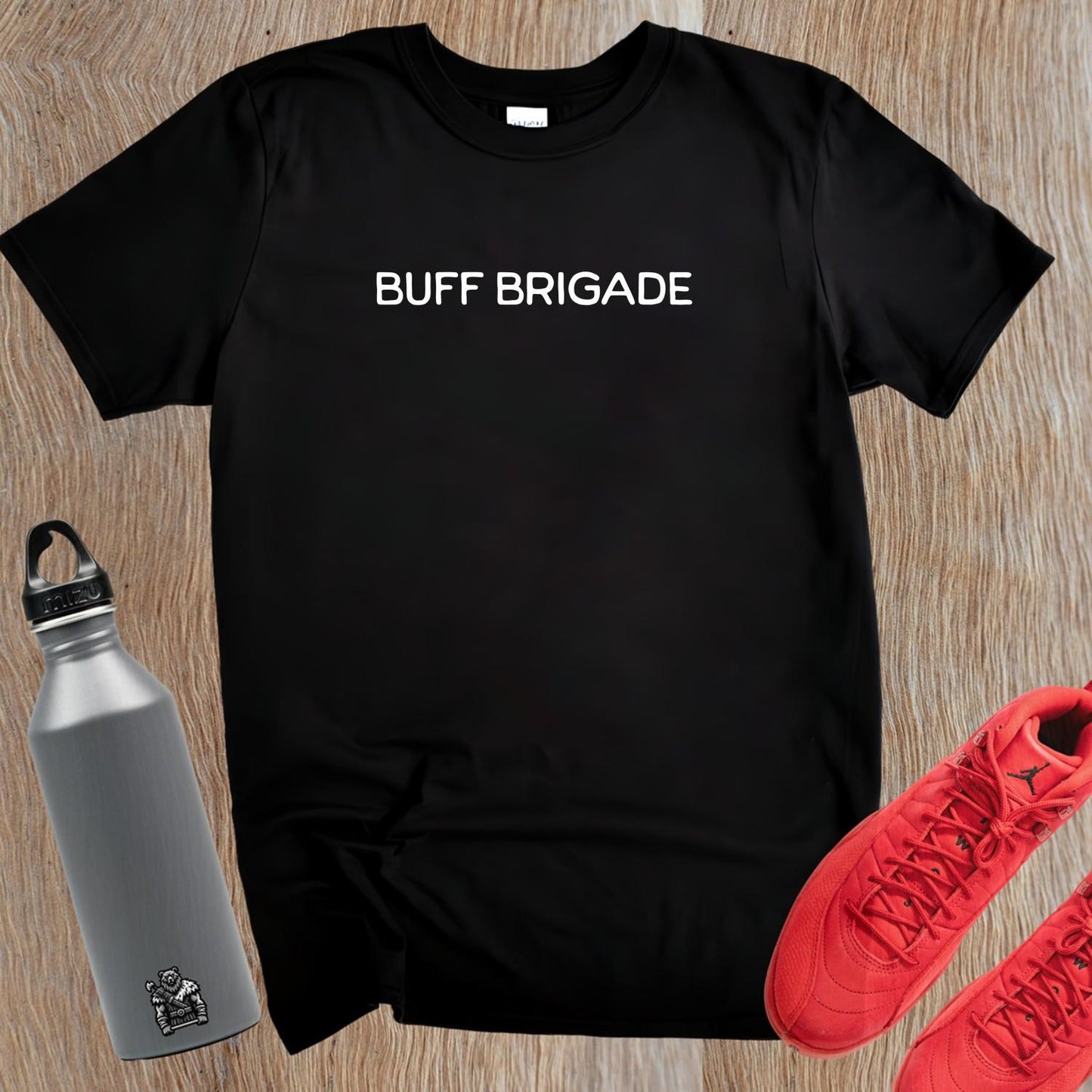 "Buff Brigade T-shirt for fitness enthusiasts featuring bold design, perfect for workouts, casual wear, and motivating gym culture."