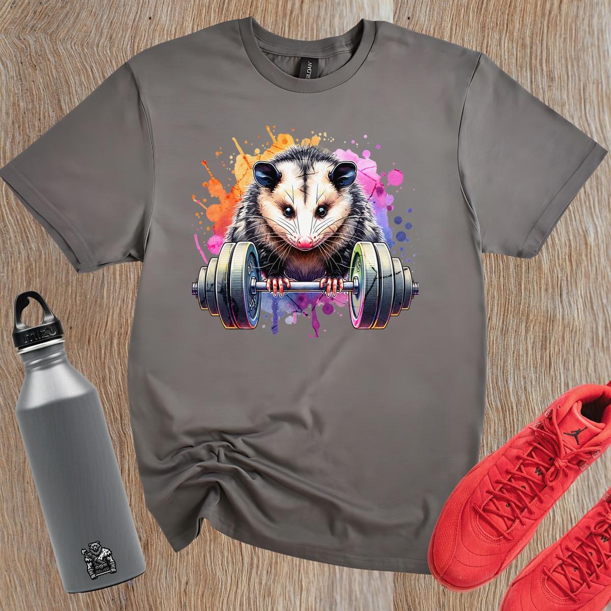"Vibrant gym T-shirt featuring a playful opossum lifting weights, blending fitness and fun, perfect for workout enthusiasts."