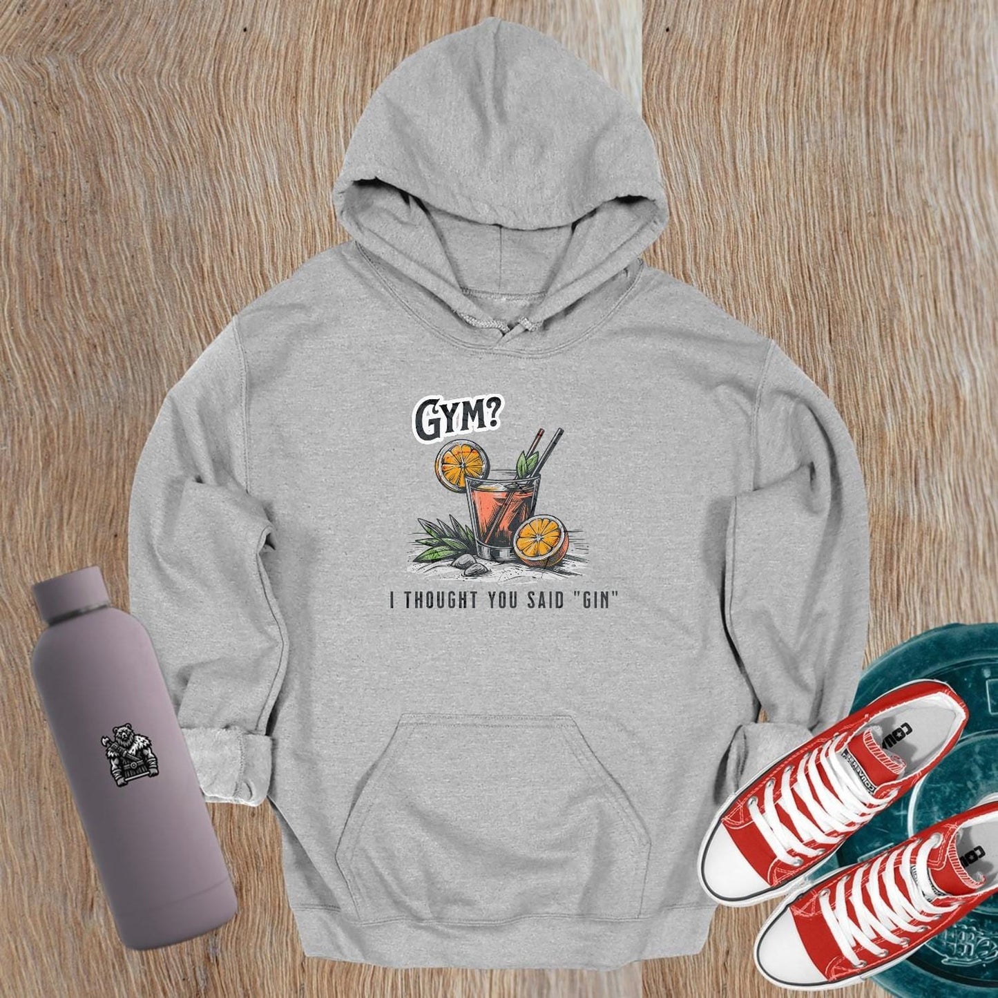 “Playful 'Gym? I Thought You Said ‘Gin’' hoodie featuring vibrant graphics, perfect for stylish workouts and casual outings.”