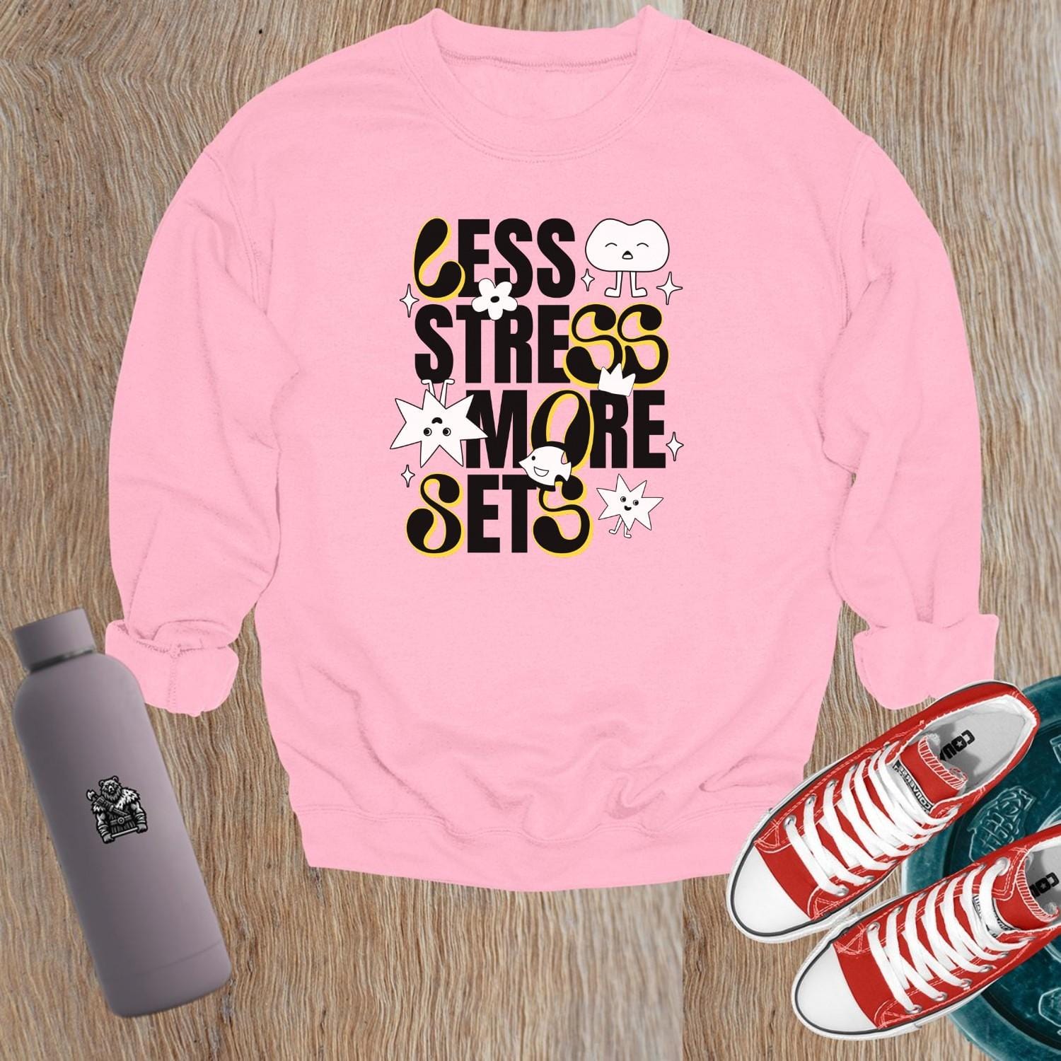 "Vibrant gym sweatshirt with unique designs, ideal for workouts or lounging, paired with leggings for a confident, stylish look."