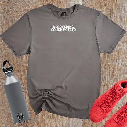 Alt text: "Stylish ‘Recovering Couch Potato’ T-shirt featuring bold graphic design, perfect for workouts or casual outings, showcasing fitness humor."