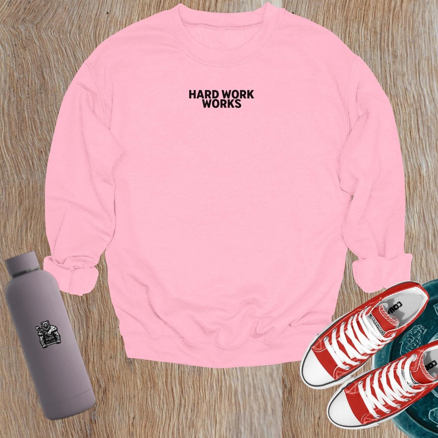 "Hard Work Works gym sweatshirt featuring a motivational graphic, perfect for layering pre- or post-workout, blending style and comfort."