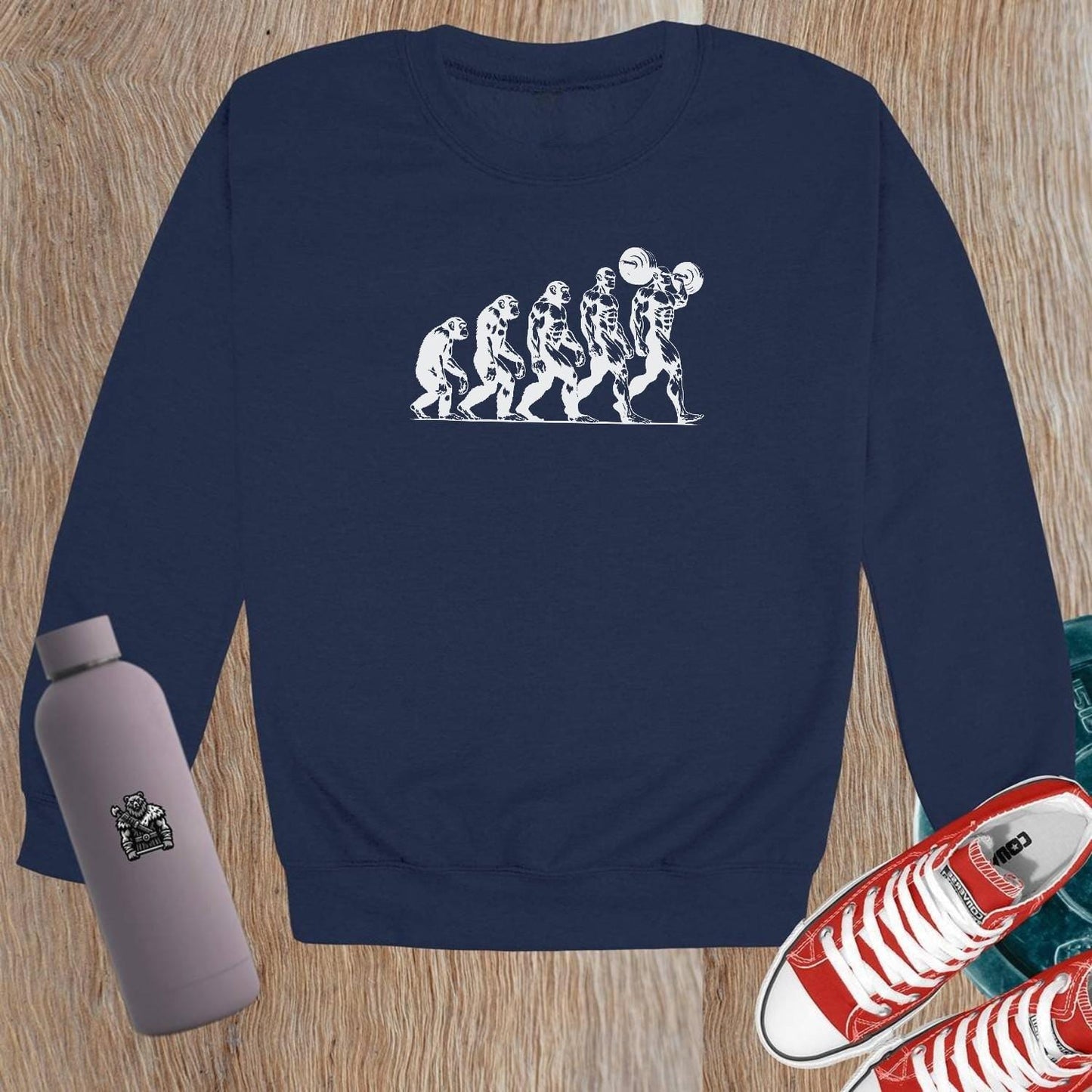 "Graphic gym crewneck sweatshirt featuring bold 'Evolution' design, perfect for fitness enthusiasts to showcase strength and transformation."