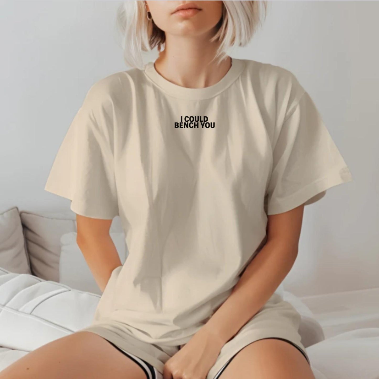 "Bold gym T-shirt with playful 'I Could Bench You' phrase, designed for active wear. Perfect for weightlifting and cardio workouts."