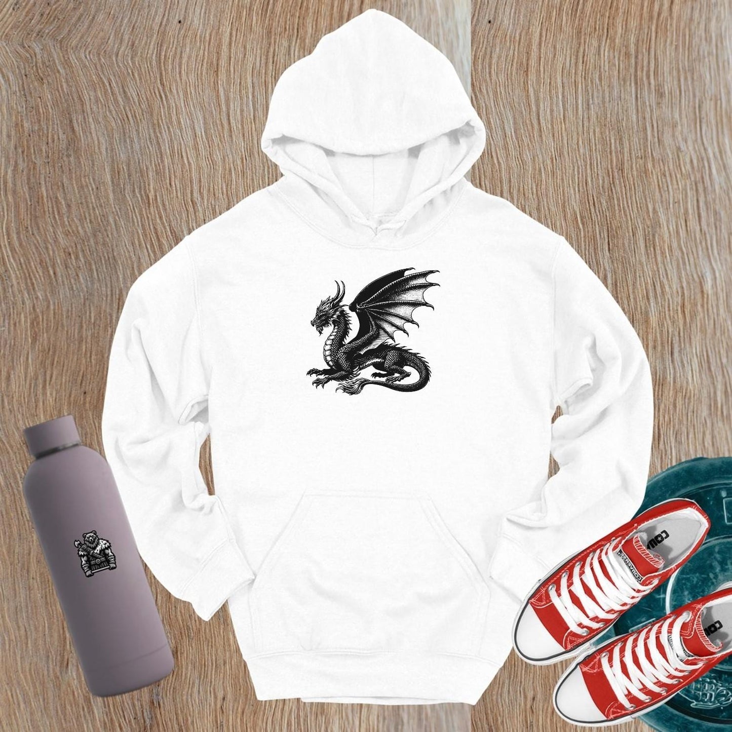 "Black gym hoodie featuring a bold strength logo, relaxed fit for comfort and style, perfect for workouts and casual wear."