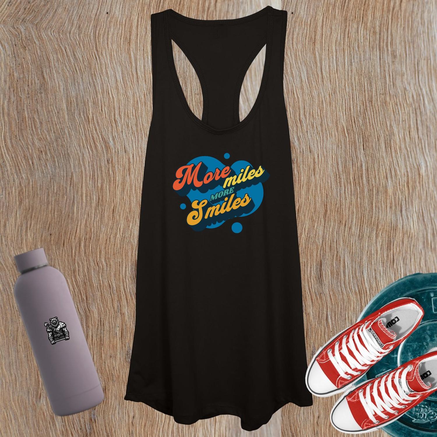 "Vibrant women's gym tank top featuring 'More Miles, More Smiles' motto, perfect for workouts and casual outings. Stylish design."