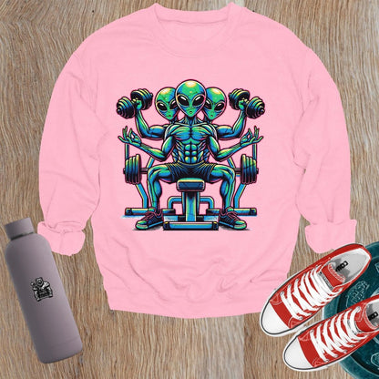 "Vibrant gym sweatshirt featuring a bold alien lifter graphic, perfect for fitness enthusiasts. Energetic design for workouts and casual wear."