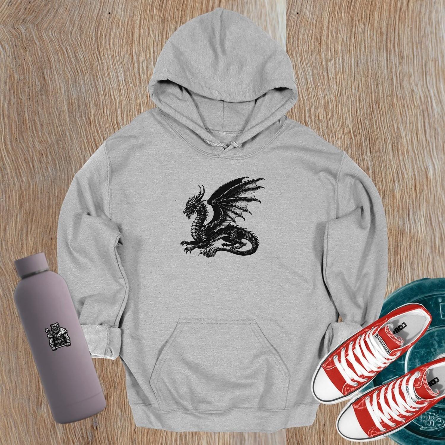 "Black gym hoodie featuring a bold strength logo, relaxed fit for comfort and style, perfect for workouts and casual wear."