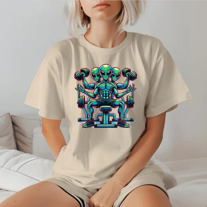 "Colorful graphic of powerful aliens lifting weights on a gym t-shirt, inspiring fitness goals and showcasing unique workout style."