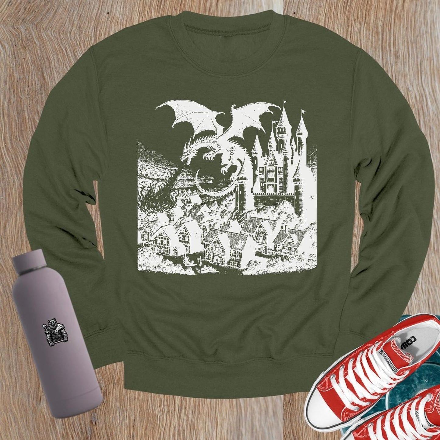 "Image of a vibrant dragon and castle graphic on a crewneck sweatshirt, perfect for gym wear and casual outings. Elevate your style!"